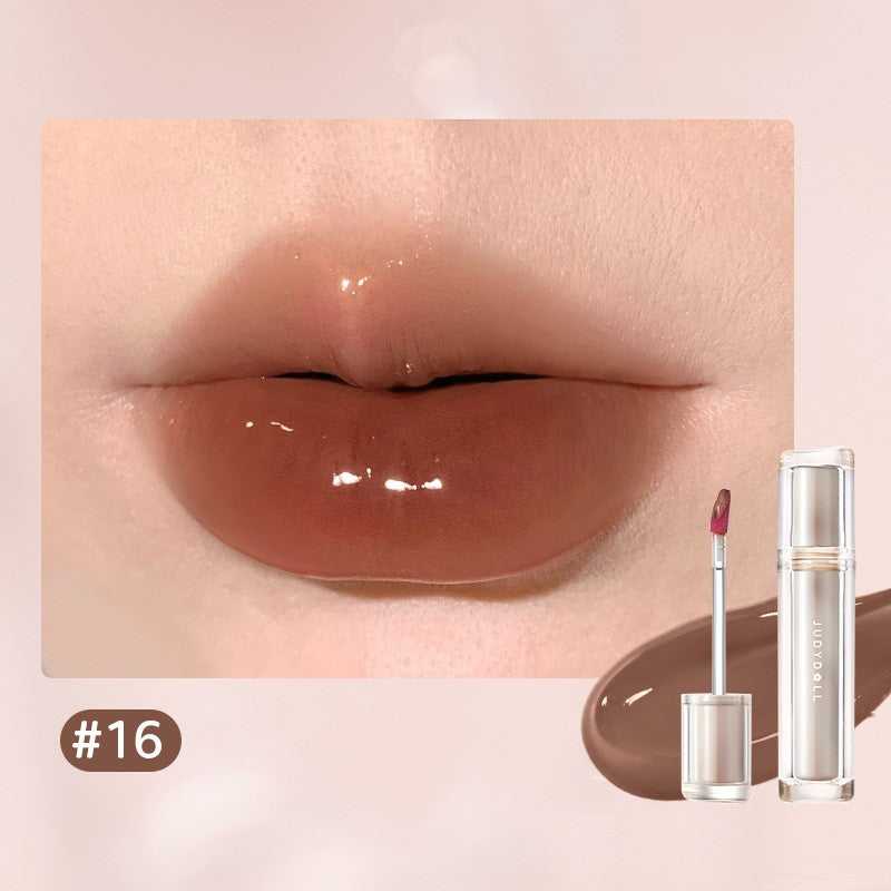 Iced Tea Mirror Lip Gloss Glassy Brown Jelly Lipstick Shine in four shades: Citrus, Brown, Violet, and Peach. Sleek tubes with glossy finish.