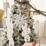 Acrylic Snowflake Christmas Decorations Transparent Tree Pendants hanging on a snowy Christmas tree. Ideal for DIY holiday decor and winter themes.