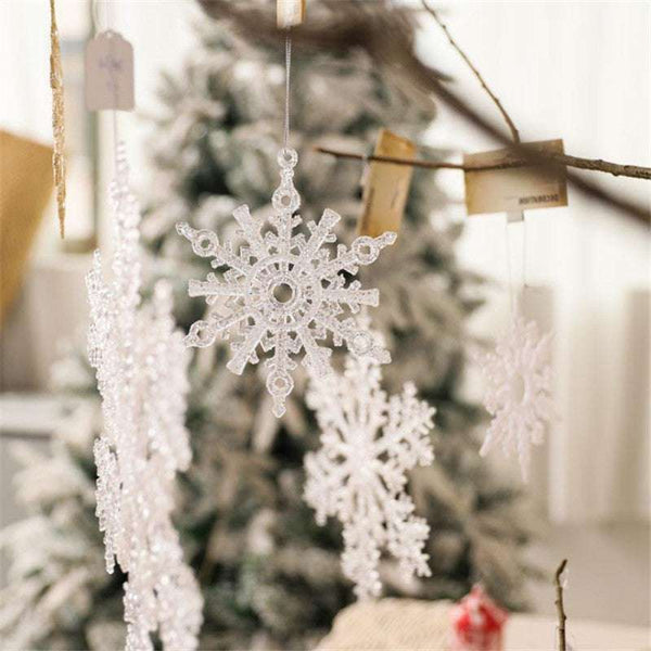Acrylic Snowflake Christmas Decorations Transparent Tree Pendants hanging on a snowy Christmas tree. Ideal for DIY holiday decor and winter themes.