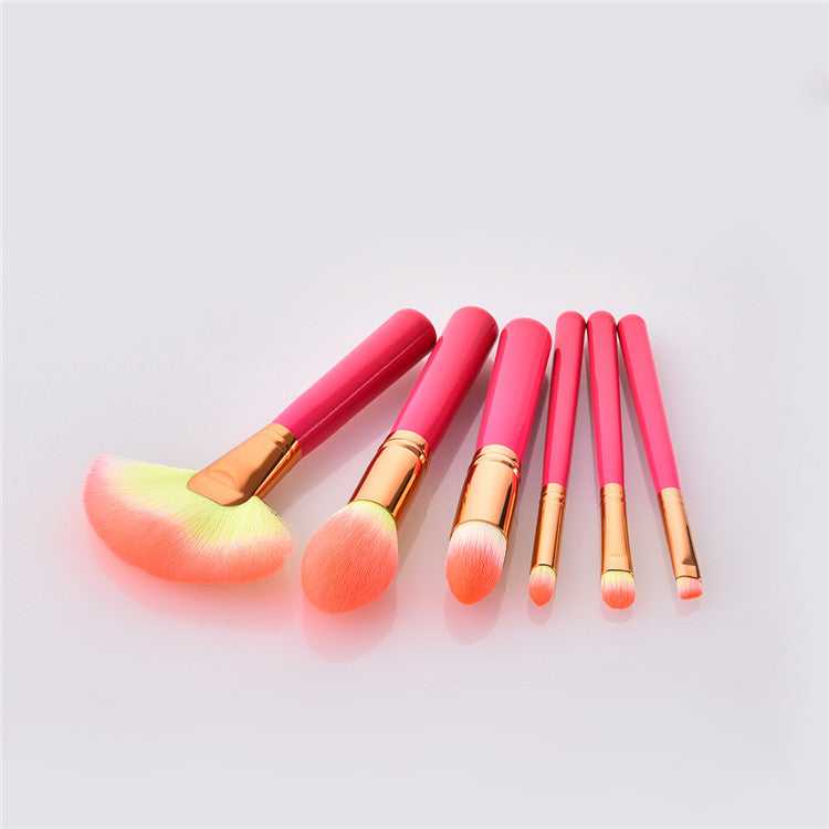 Cosmetic makeup brush set with soft synthetic bristles and pink handles, ideal for professional beauty and home use applications.