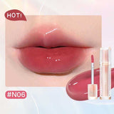 Iced Tea Mirror Lip Gloss Glassy Brown Jelly Lipstick Shine in four shades: Citrus, Brown, Violet, and Peach. Sleek tubes with glossy finish.