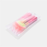Cosmetic makeup brush set with soft synthetic bristles and pink handles, ideal for professional beauty and home use applications.