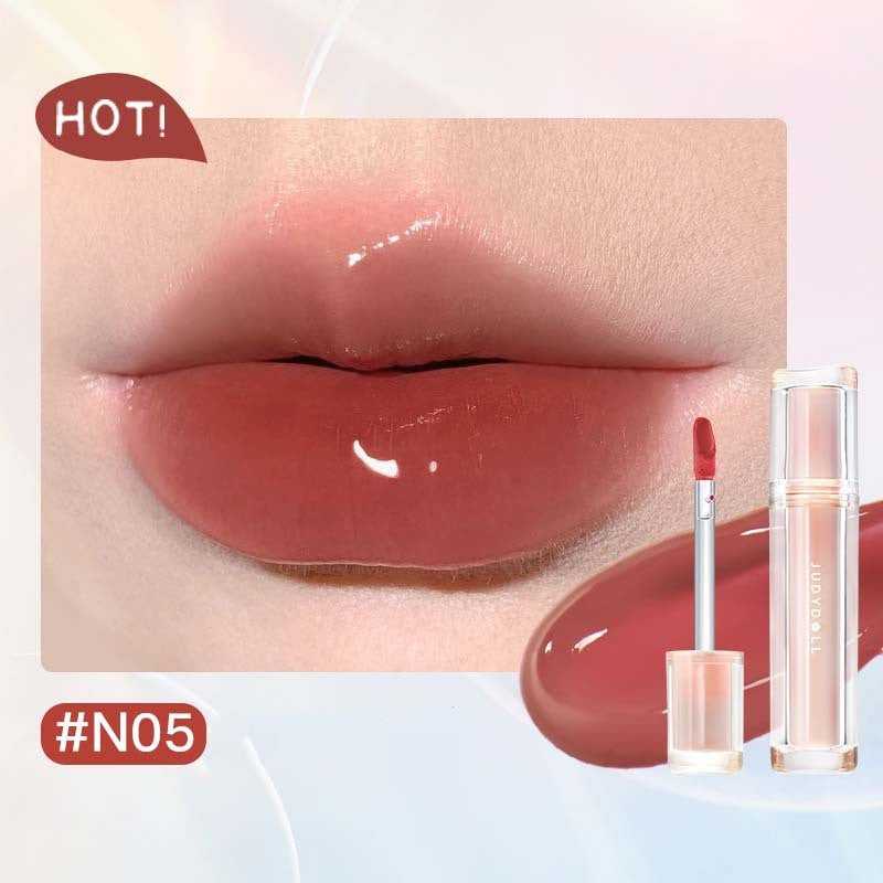 Iced Tea Mirror Lip Gloss Glassy Brown Jelly Lipstick Shine in four shades: Citrus, Brown, Violet, and Peach. Sleek tubes with glossy finish.