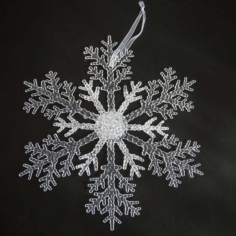 Acrylic Snowflake Christmas Decorations Transparent Tree Pendants hanging on a snowy Christmas tree. Ideal for DIY holiday decor and winter themes.
