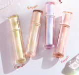 Iced Tea Mirror Lip Gloss Glassy Brown Jelly Lipstick Shine in four shades: Citrus, Brown, Violet, and Peach. Sleek tubes with glossy finish.