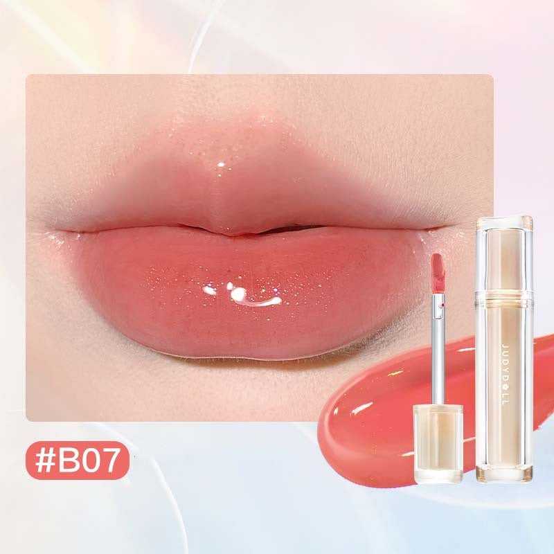 Iced Tea Mirror Lip Gloss Glassy Brown Jelly Lipstick Shine in four shades: Citrus, Brown, Violet, and Peach. Sleek tubes with glossy finish.