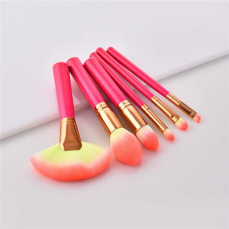 Cosmetic makeup brush set with soft synthetic bristles and pink handles, ideal for professional beauty and home use applications.
