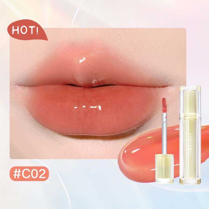 Iced Tea Mirror Lip Gloss Glassy Brown Jelly Lipstick Shine in four shades: Citrus, Brown, Violet, and Peach. Sleek tubes with glossy finish.