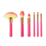 Cosmetic makeup brush set with soft synthetic bristles and pink handles, ideal for professional beauty and home use applications.