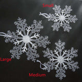Acrylic Snowflake Christmas Decorations Transparent Tree Pendants hanging on a snowy Christmas tree. Ideal for DIY holiday decor and winter themes.