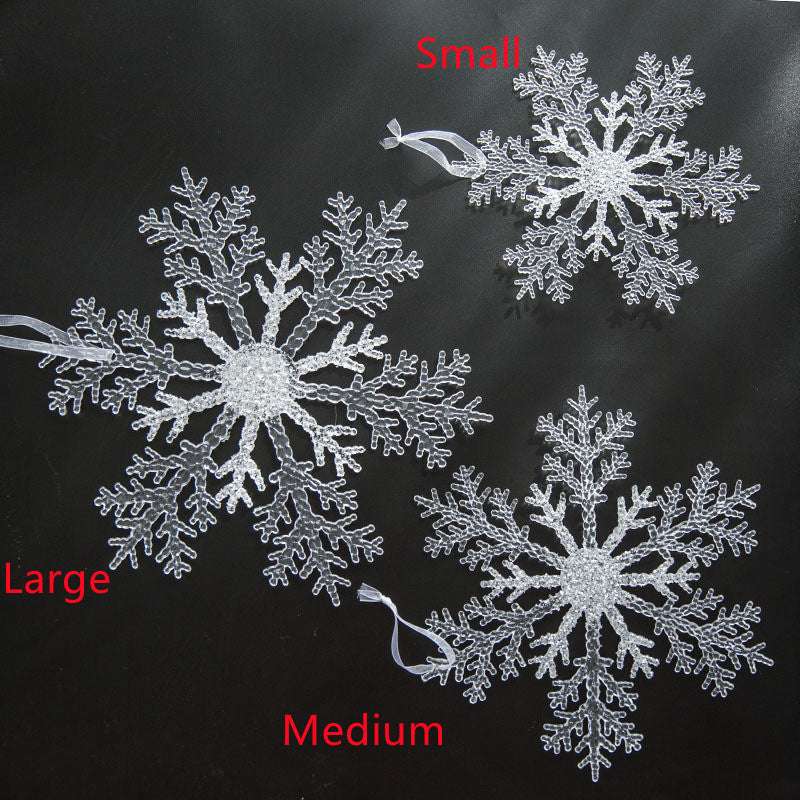 Acrylic Snowflake Christmas Decorations Transparent Tree Pendants hanging on a snowy Christmas tree. Ideal for DIY holiday decor and winter themes.