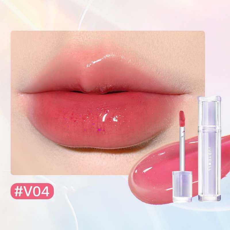 Iced Tea Mirror Lip Gloss Glassy Brown Jelly Lipstick Shine in four shades: Citrus, Brown, Violet, and Peach. Sleek tubes with glossy finish.