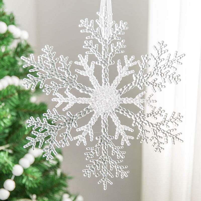 Acrylic Snowflake Christmas Decorations Transparent Tree Pendants hanging on a snowy Christmas tree. Ideal for DIY holiday decor and winter themes.